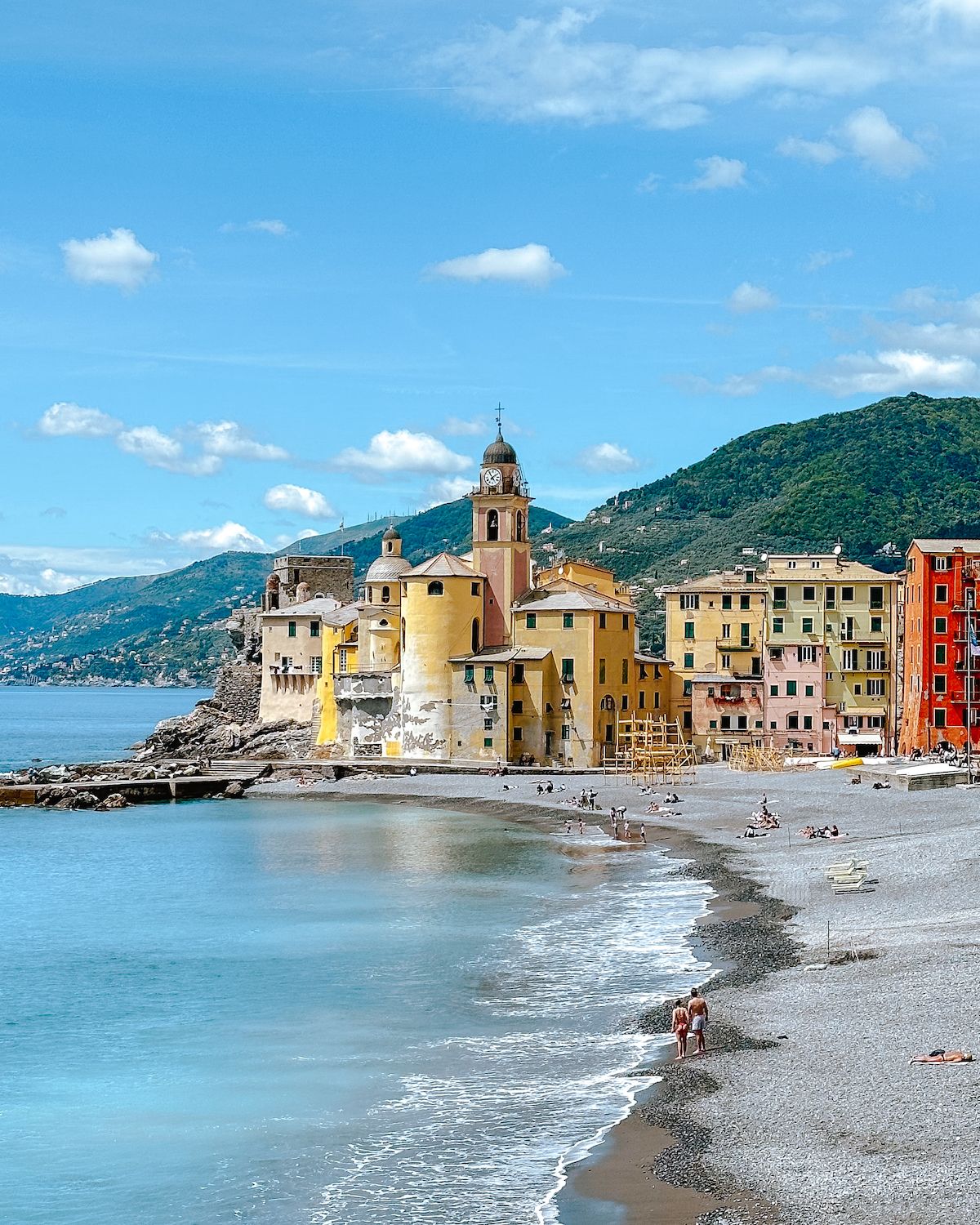 People walking and relaxing on the beach in Camogli