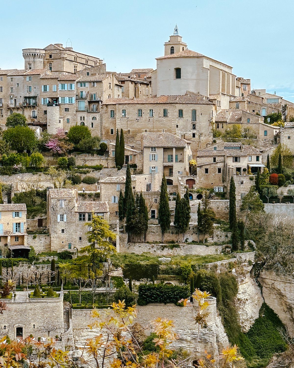 Medieval buildings cascading over a hillside in Gordes village