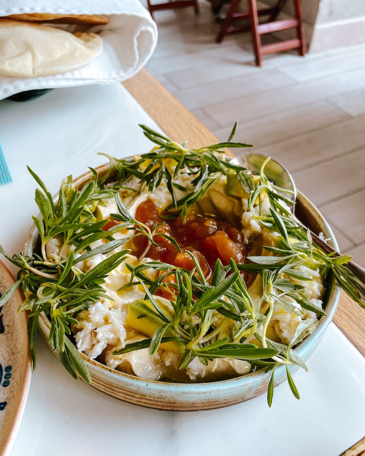 Hummus Beirut Sur Mer with chickpea puree, citrus crab, avocado and pickled apricot salsa