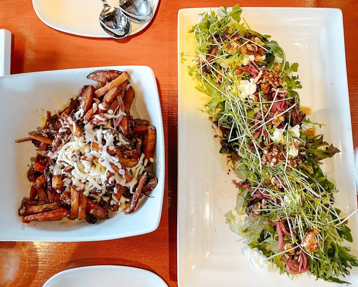 Poutine on the left and salad on the right 