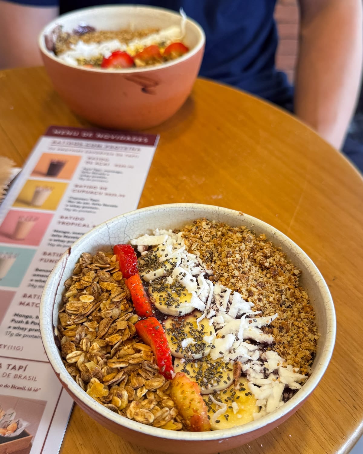 Açaí bowls topped with banana, strawberry, coconut, chia seeds, brazil nuts and granola at Tapi Tapioca.