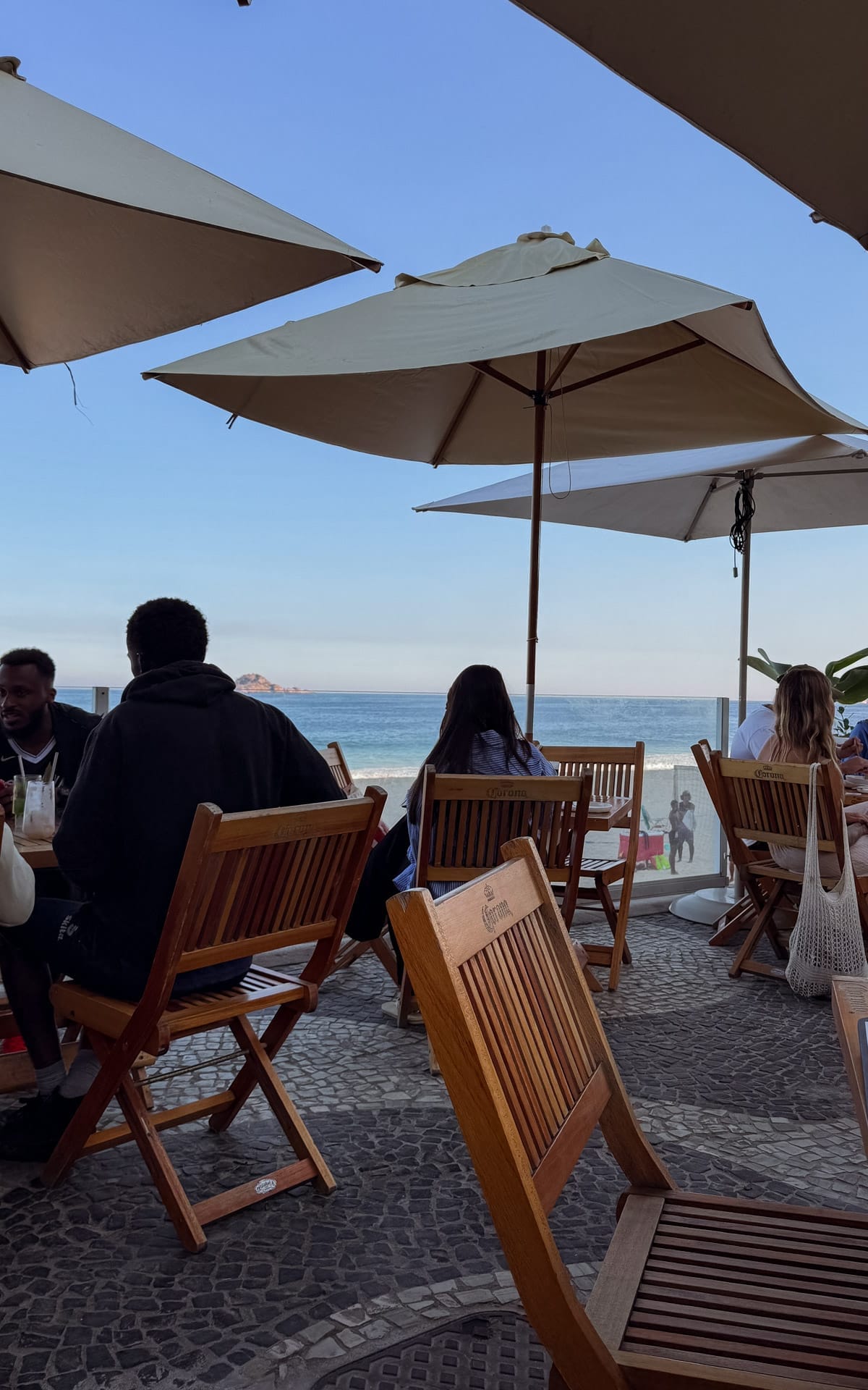 Beachfront Musa restaurant in with Pepino Beach views from shaded wooden tables, a laidback spot popular with locals.