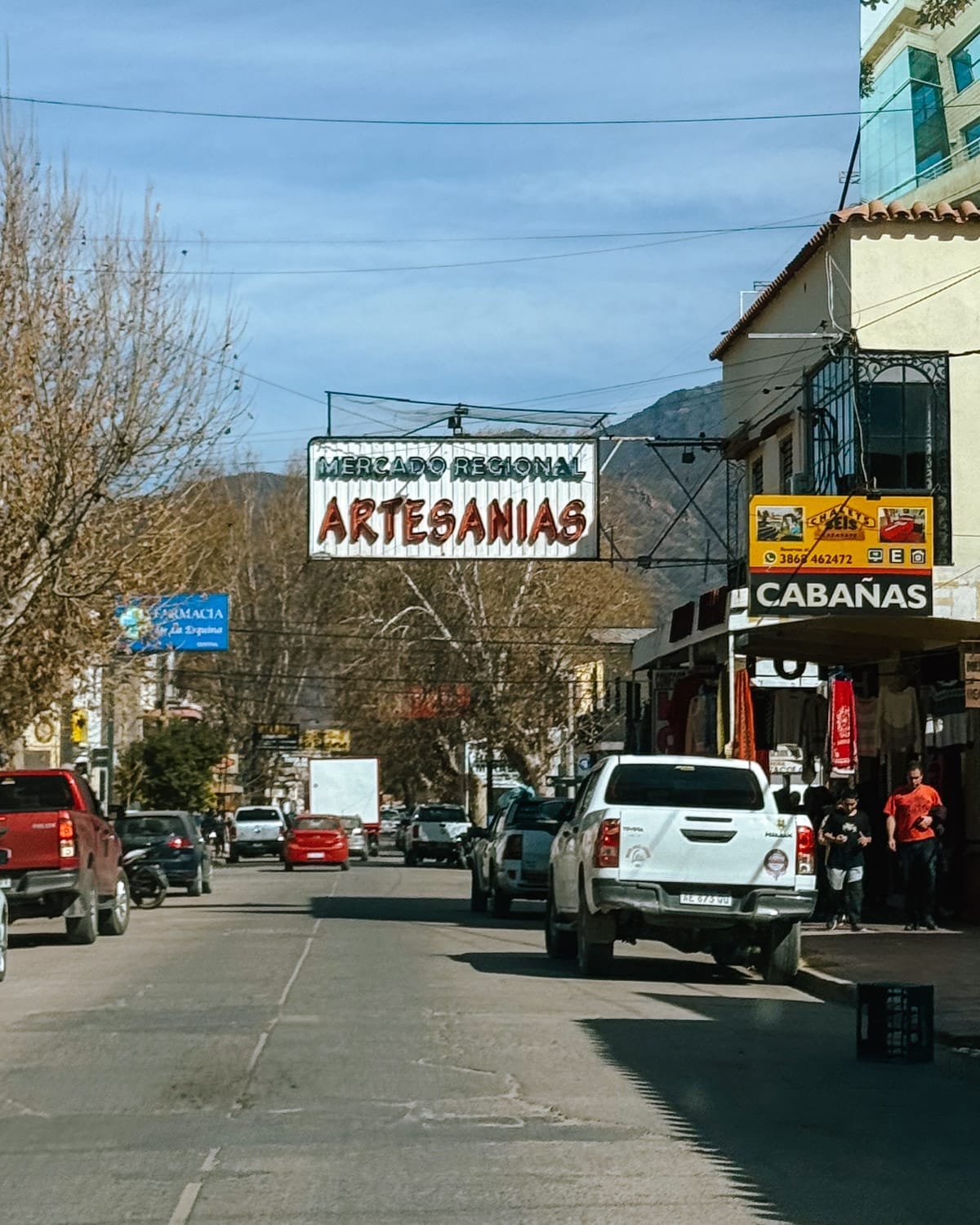 Street view of Cafayate’s artisan market under a clear blue sky.