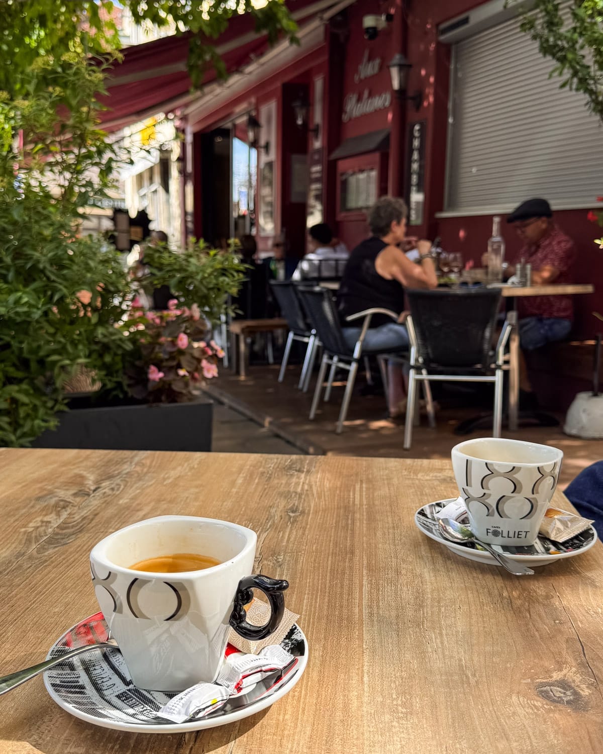 Coffee cups on a café table in Poligny’s main square.