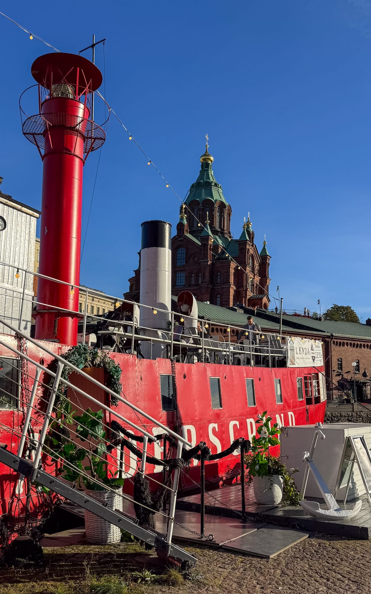 Lightvessel Relandersgrund, a red former lighthouse ship turned bar in Helsinki harbour.