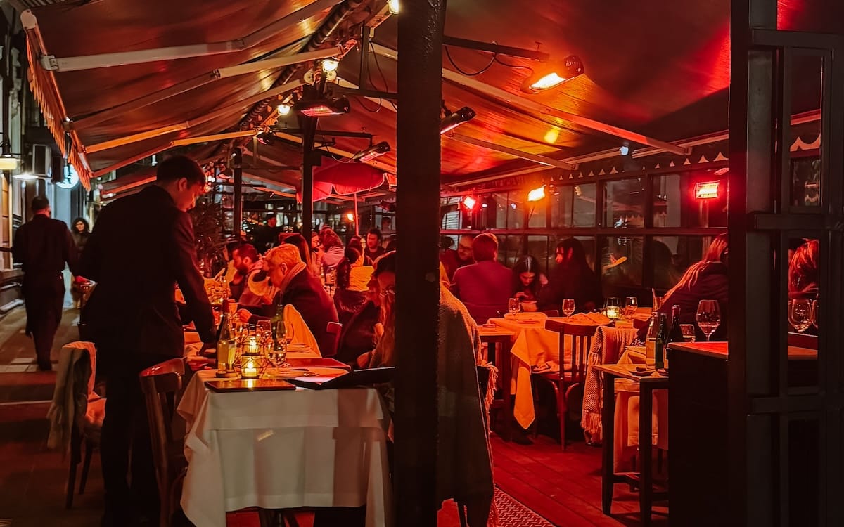 Outdoor dining at Don Julio under glowing red lights, one of the top things to do in Palermo for an evening out.